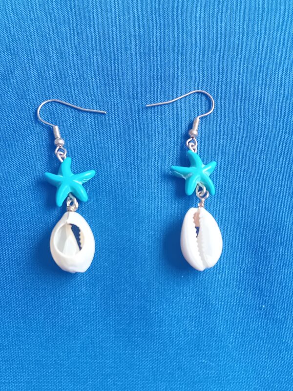 Beautiful half cowrie shell earrings with solid blue starfish