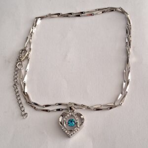 Silver coloured unusual linked chain with silver coloured heart and bright blue & diamante decoration