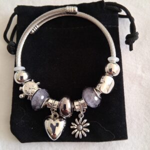 Sparkly-grey-and-silver-coloured-charm-bracelet-with-hanging-heart-and-flower