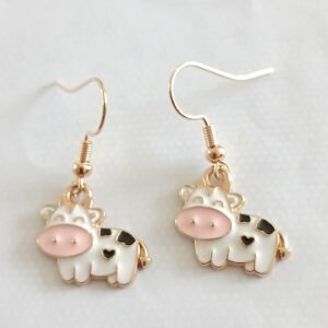 Comical white and black hanging cow earrings